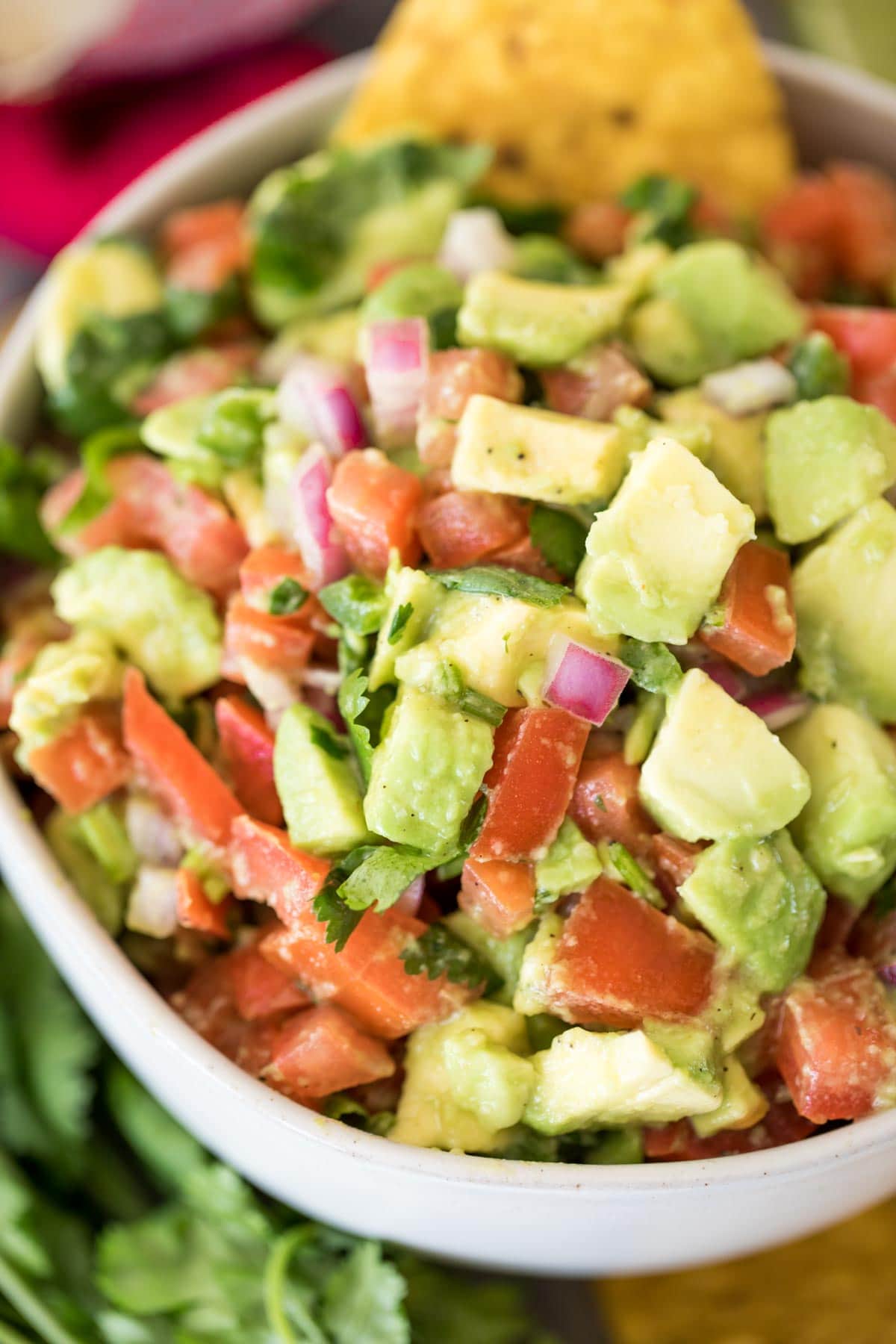 overhead of avocado salsa in white bowl