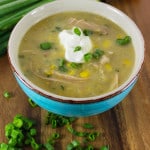 corn chowder in blue bowl with sour cream