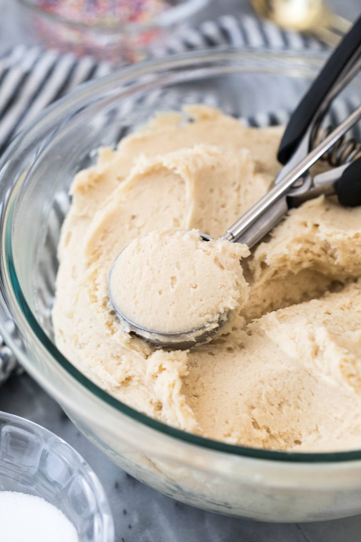 cookie dough in glass bowl with scoop