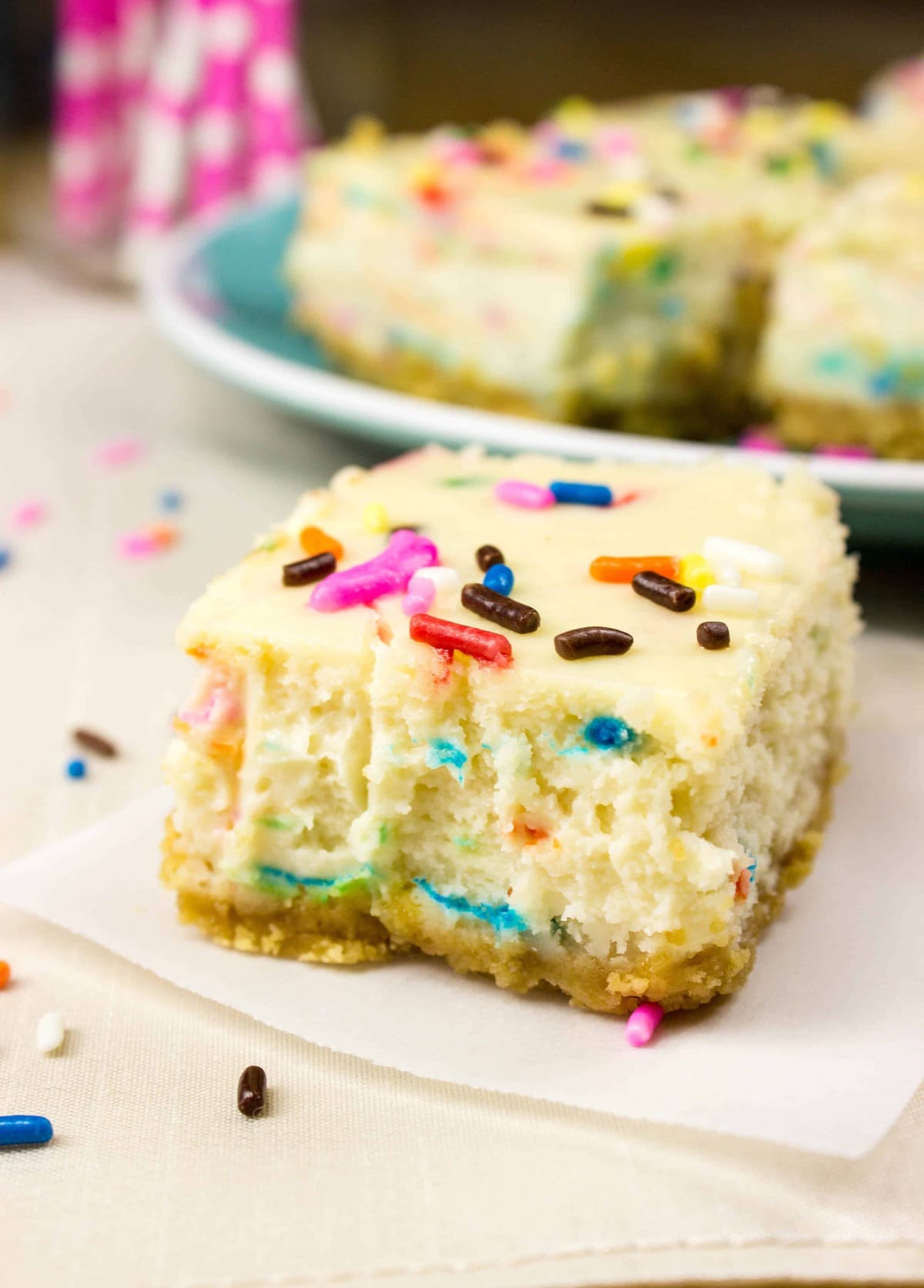 funfetti cheesecake square on white cloth