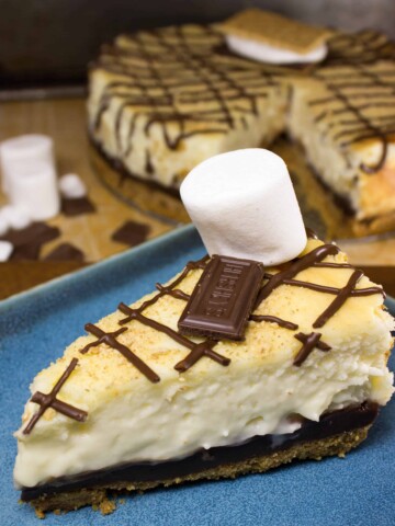 smores cheesecake slice on blue plate