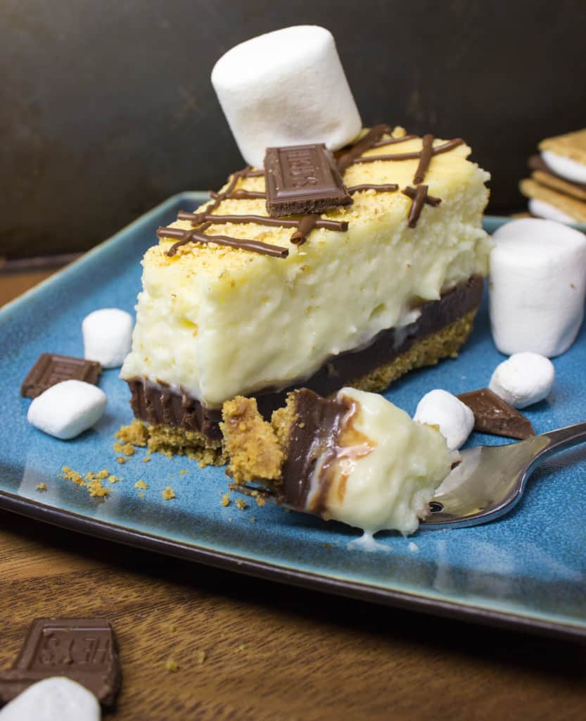 Slice of s'mores Cheesecake with fork