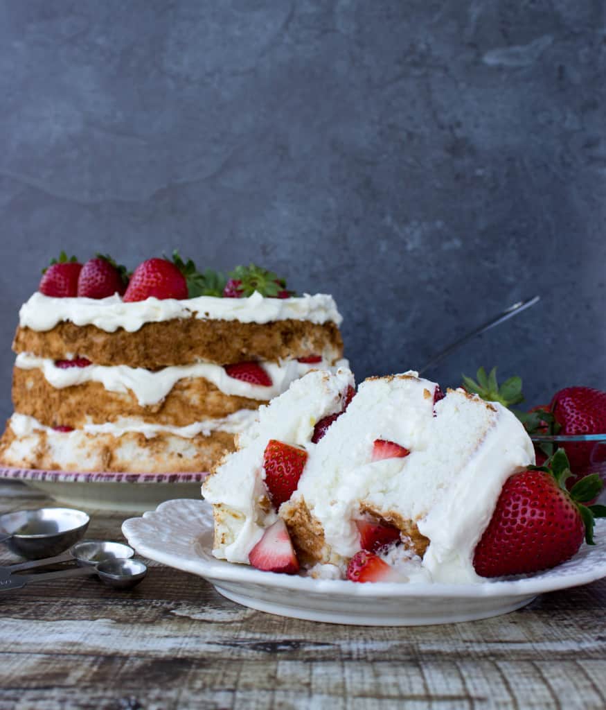 slice of layered angel food cake, showing strawberry center