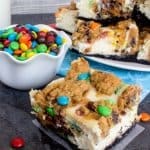 cheesecake and cookie swirled bars with M&ms