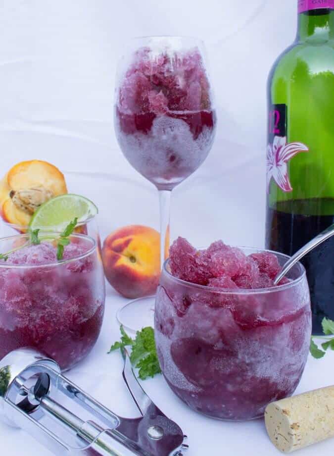 Peach Sangria Granita in wine glasses