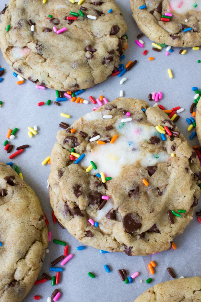 Funfetti filled chocolate chip cookies on baking sheet