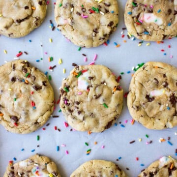 overhead view of funfetti filled chocolate chip cookies on baking sheet