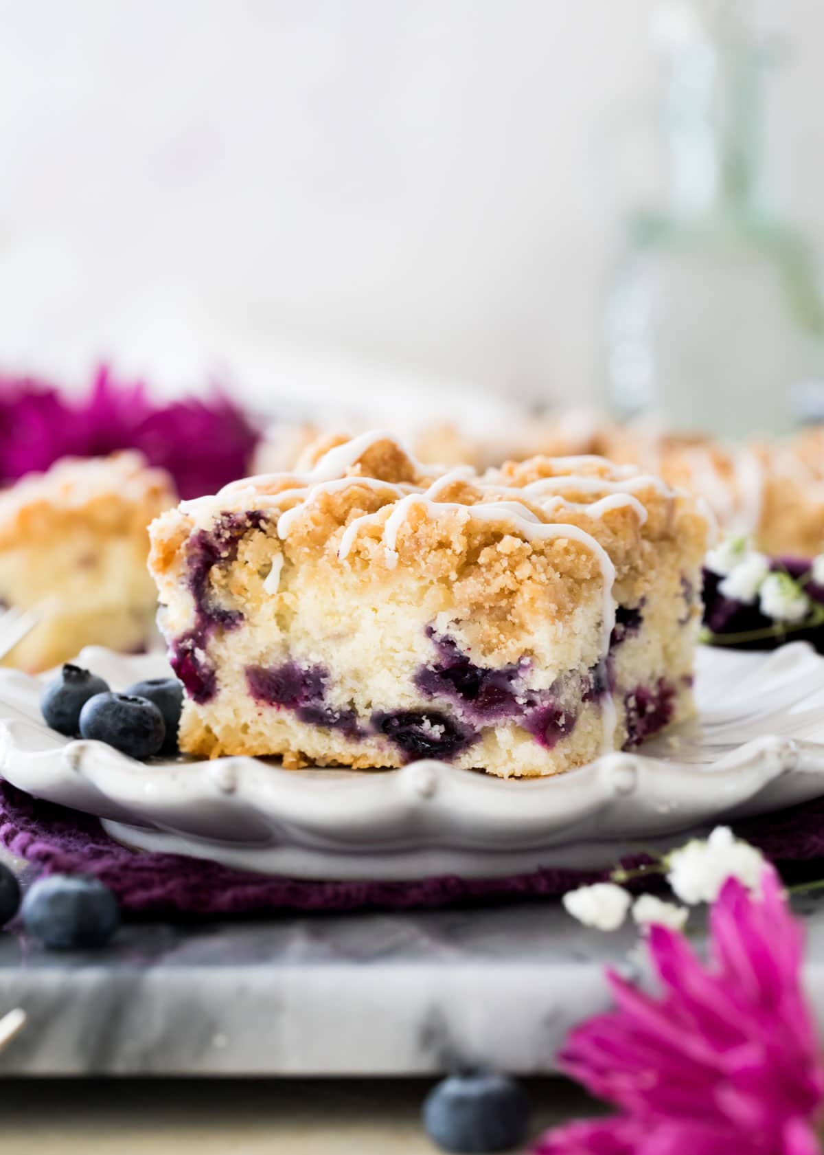 Blueberry coffee cake on white plate