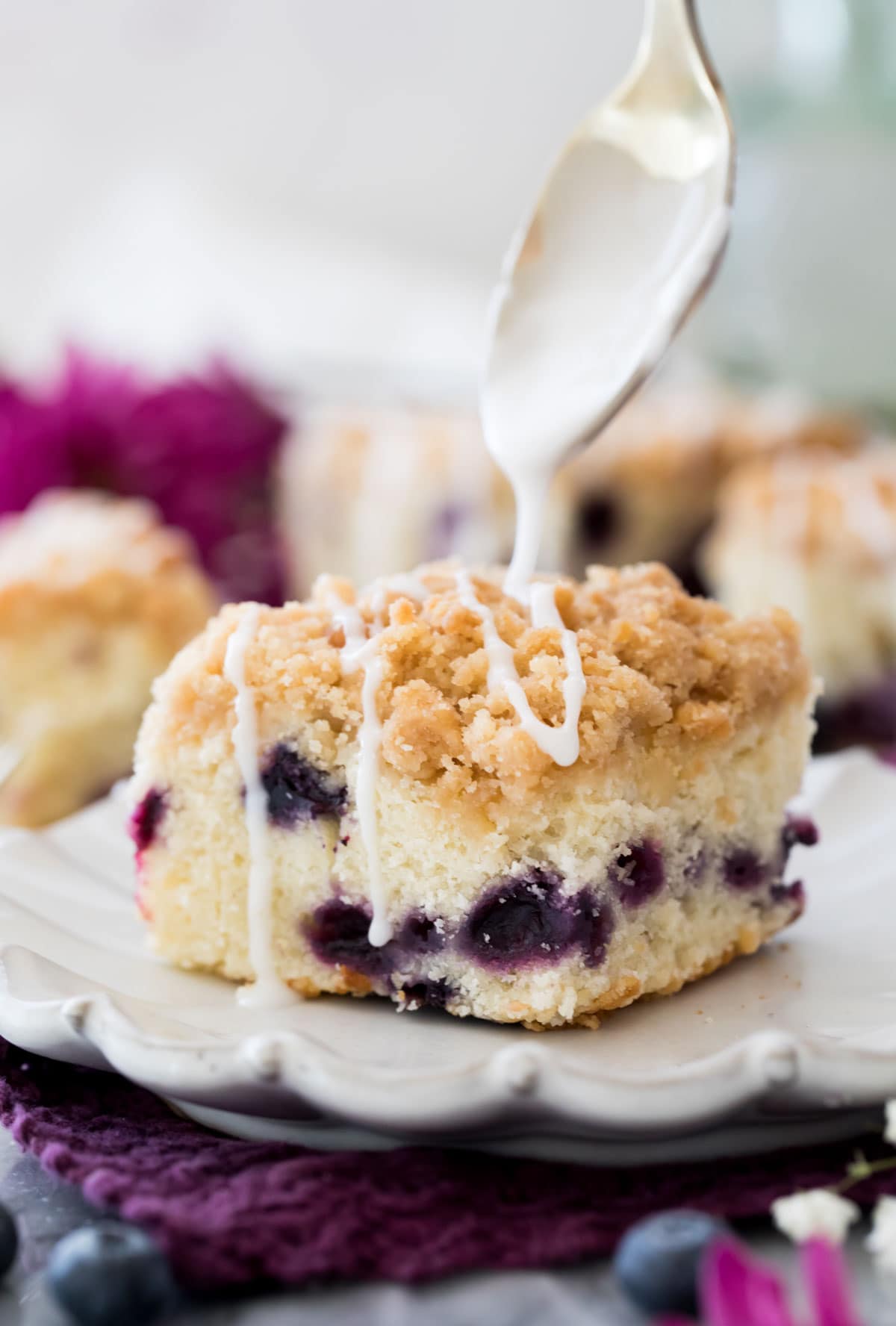 Blueberry coffee cake on white plate