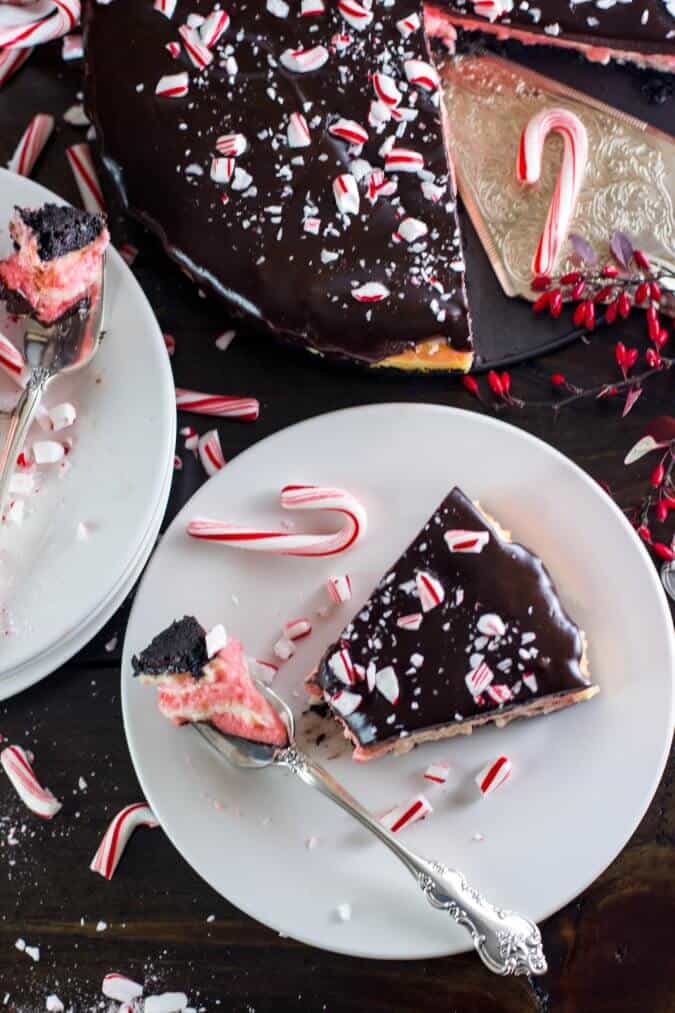 Candy Cane Cheesecake on white plate with fork