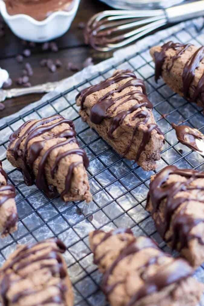 chocolate scones with drizzle on cooling rack
