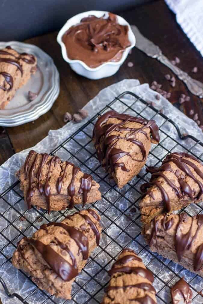 chocolate scones with glaze on cooling rack