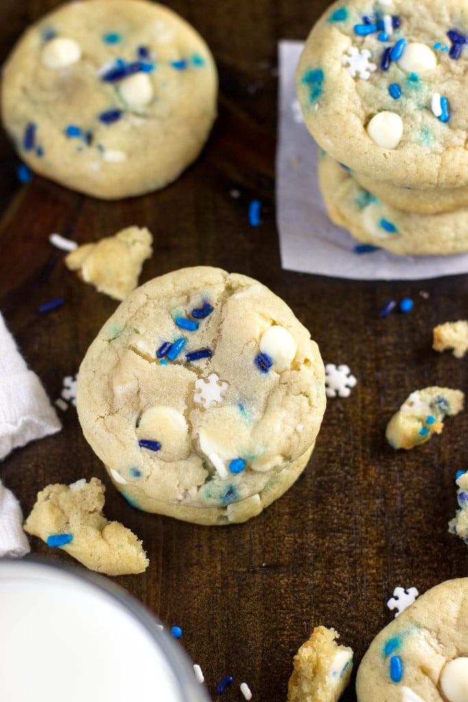 blue and white sprinkle cookies on board