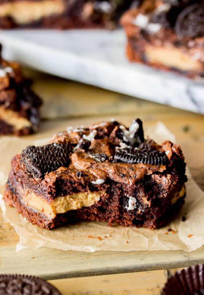 Dirty Brownies -- Chewy, chocolaty brownies layered with Reese's peanut butter cups and loaded with crushed Oreos || Sugar Spun Run