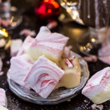 Peppermint marshmallow candy stacked on a silver plate