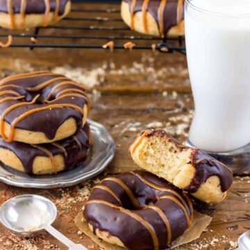 Peanut butter donuts, tall glass of milk in the background