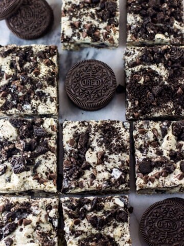 Overhead of cookies and cream oreo bars, some squares removed and a single oreo in its place
