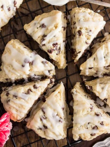 Overhead shot of chocolate chip scones, drizzled with glaze