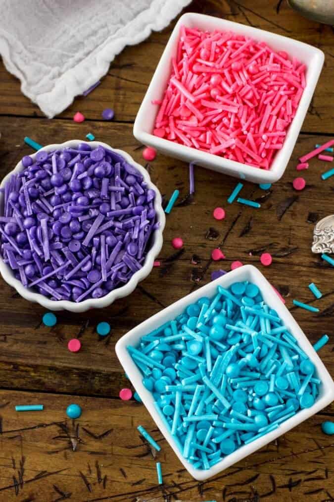 pink purple and blue sprinkles in dishes