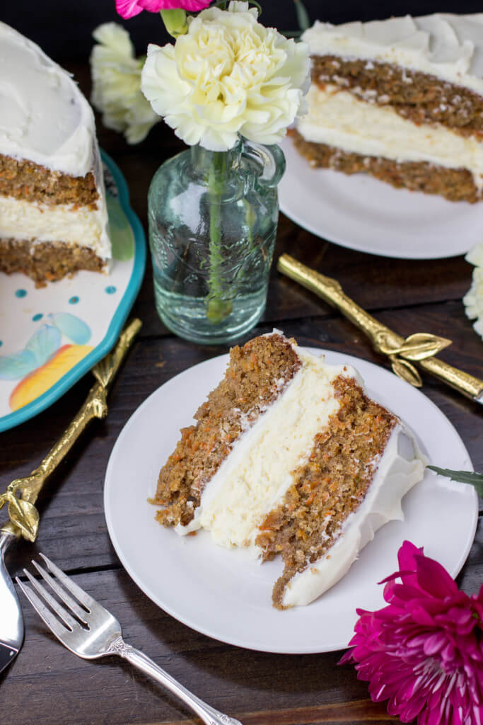 A decadent carrot cake with a surprise cheesecake layer in the middle -- SugarSpunRun.com