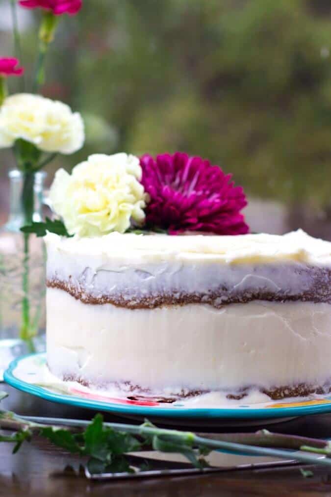 A decadent carrot cake with a surprise cheesecake layer in the middle -- SugarSpunRun.com