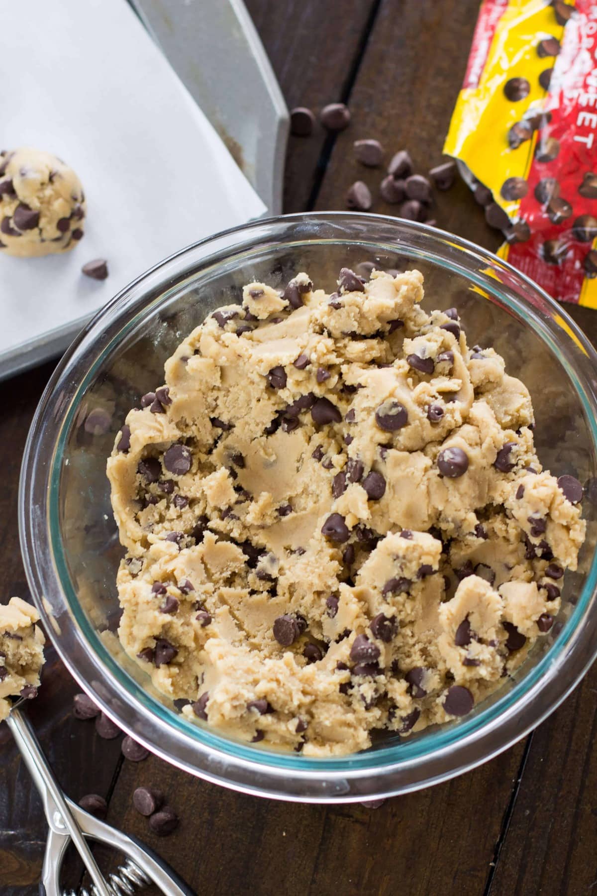 a glass bowl of chocolate chip cookie dough