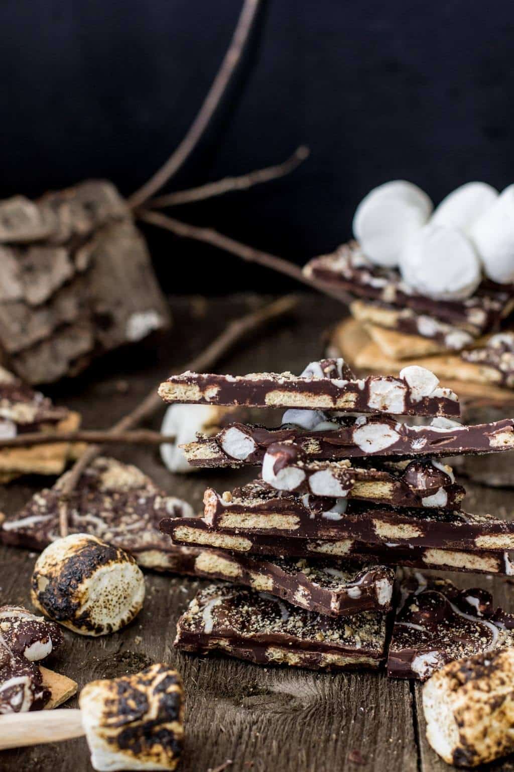 S'mores Bark! Made with dark chocolate and loaded with graham cracker crumbs and mini marshmallows, then swirled with milk chocolate and white chocolate