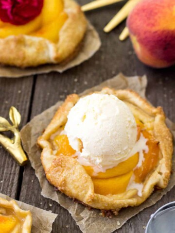 Peaches and cream galette with a scoop of vanilla ice cream on top