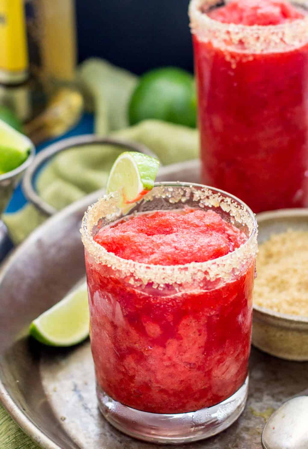 Strawberry margarita in a turbinado sugar rimmed glass