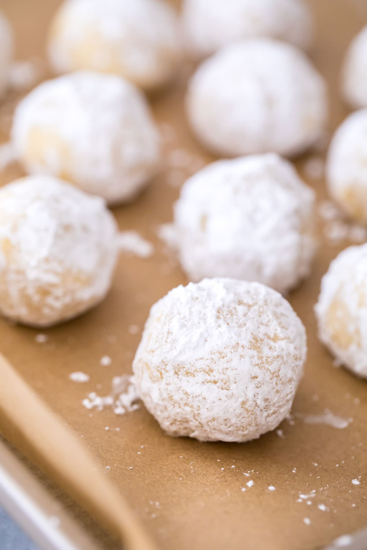 balls of cookie dough rolled in powdered sugar