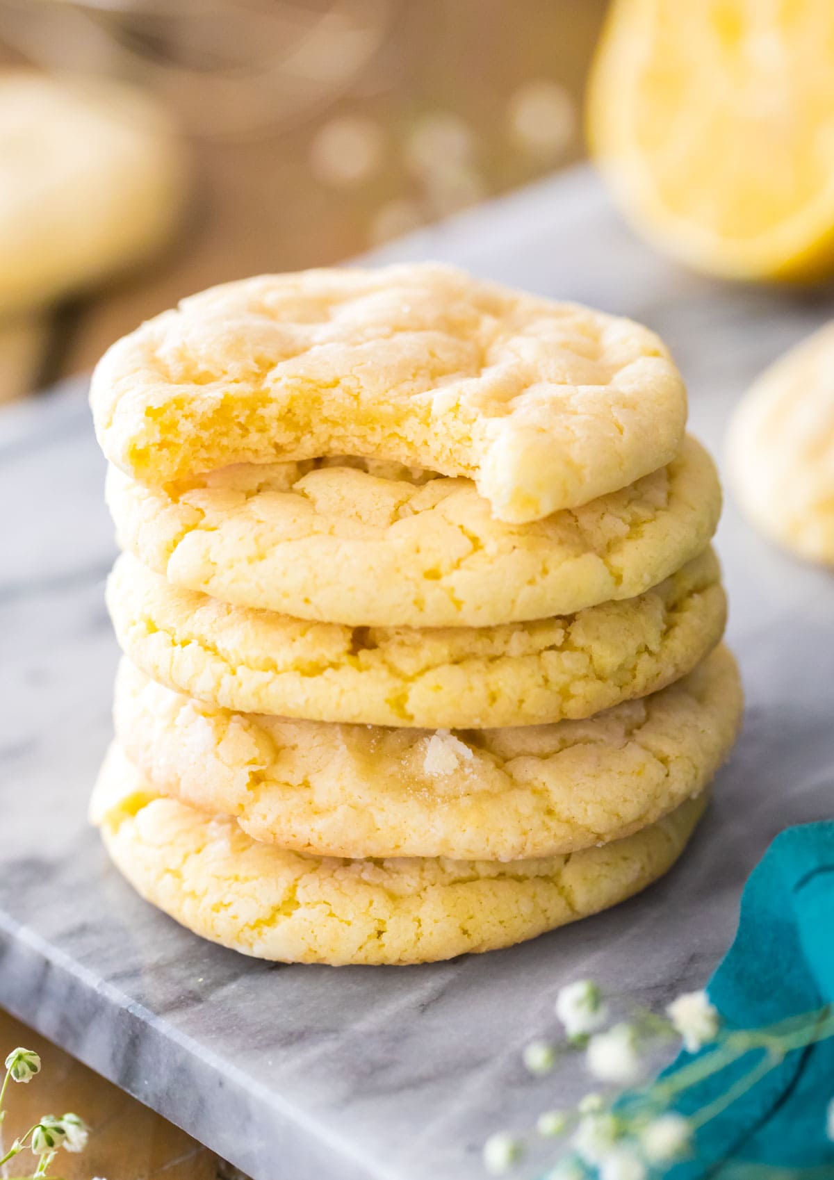 Lemon cookies stacked on marble