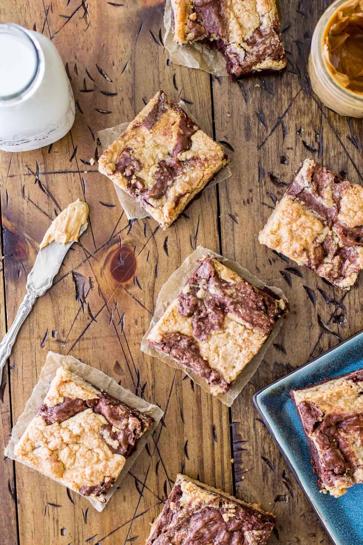 peanut butter brownie squares on wood board