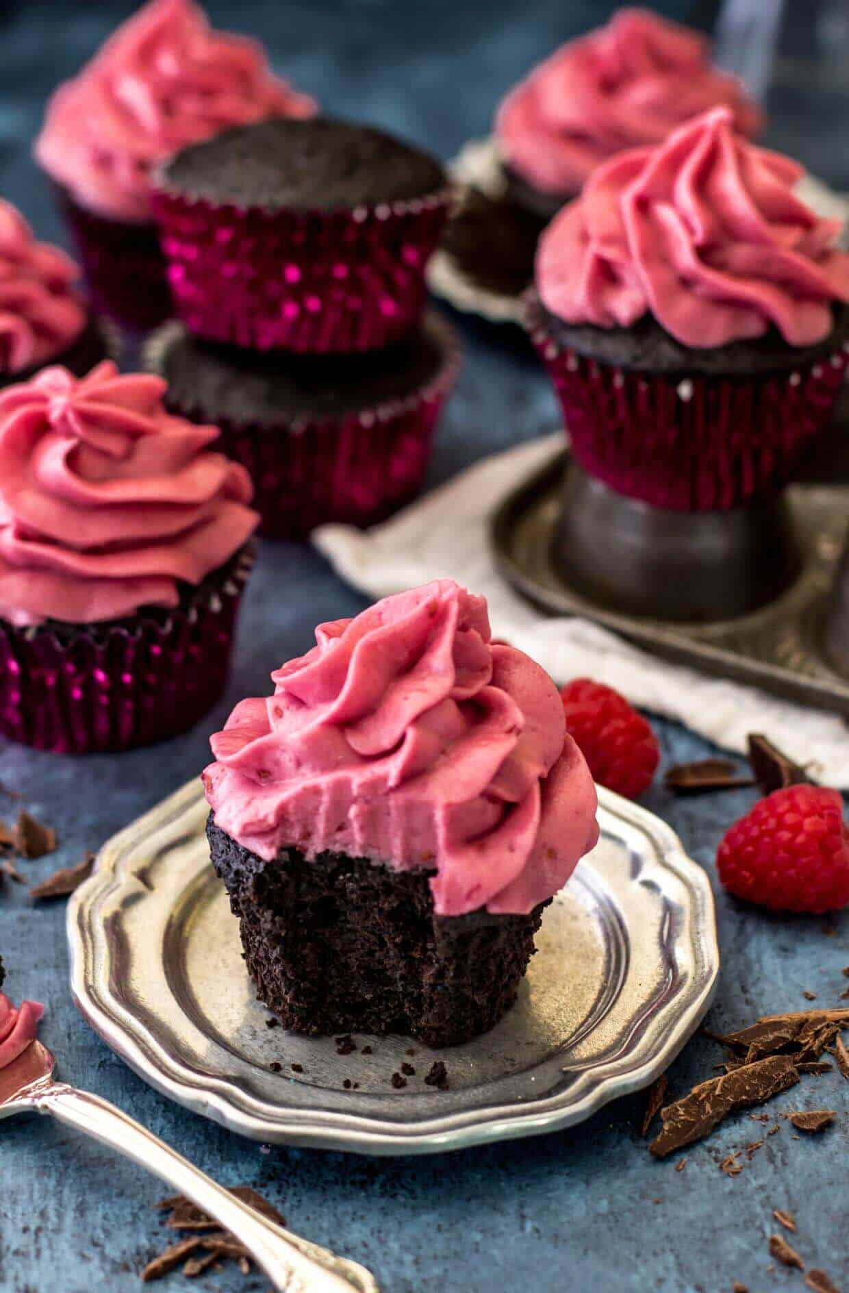 Dark Chocolate Cupcakes with Fresh Raspberry Frosting -- via Sugar Spun Run