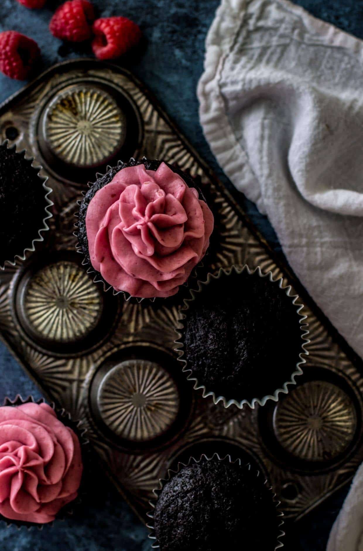 Dark Chocolate Cupcakes with Fresh Raspberry Frosting -- via Sugar Spun Run