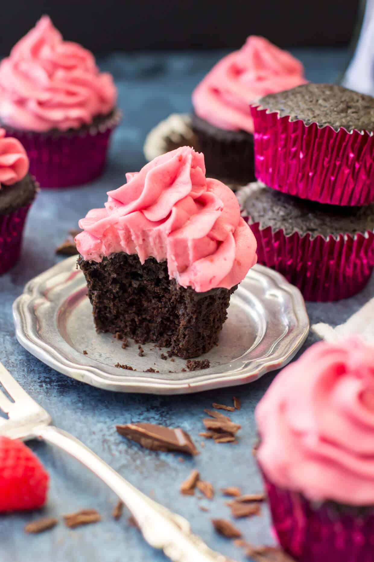 Dark Chocolate Cupcakes with Fresh Raspberry Frosting -- via Sugar Spun Run