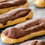 Chocolate eclairs on marble surface