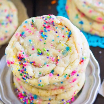 Tall stack of funfetti cookies on a silver plate
