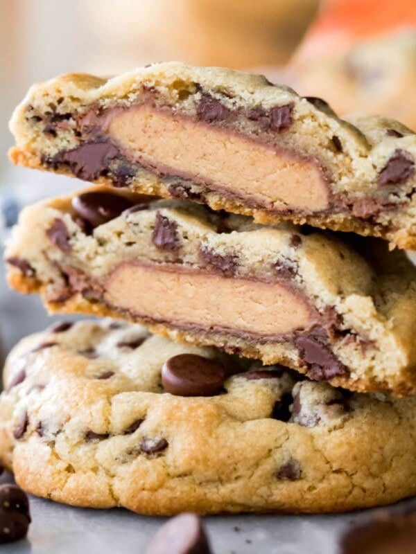 stack of peanut butter cup stuffed cookies cut in half