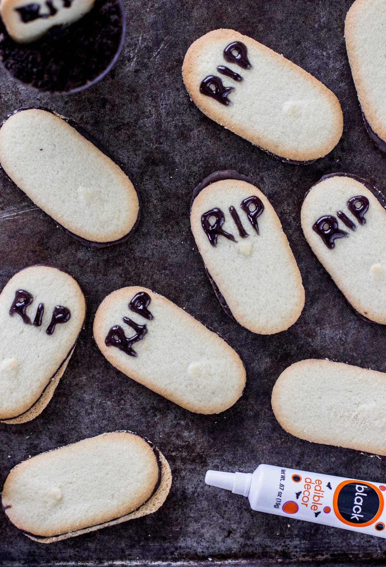 Overhead of cookies with R.I.P. written in black icing