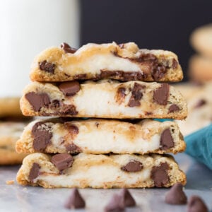 stack of cookies that have been cut in half, showing cheesecake centers