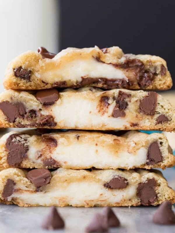 stack of cookies that have been cut in half, showing cheesecake centers