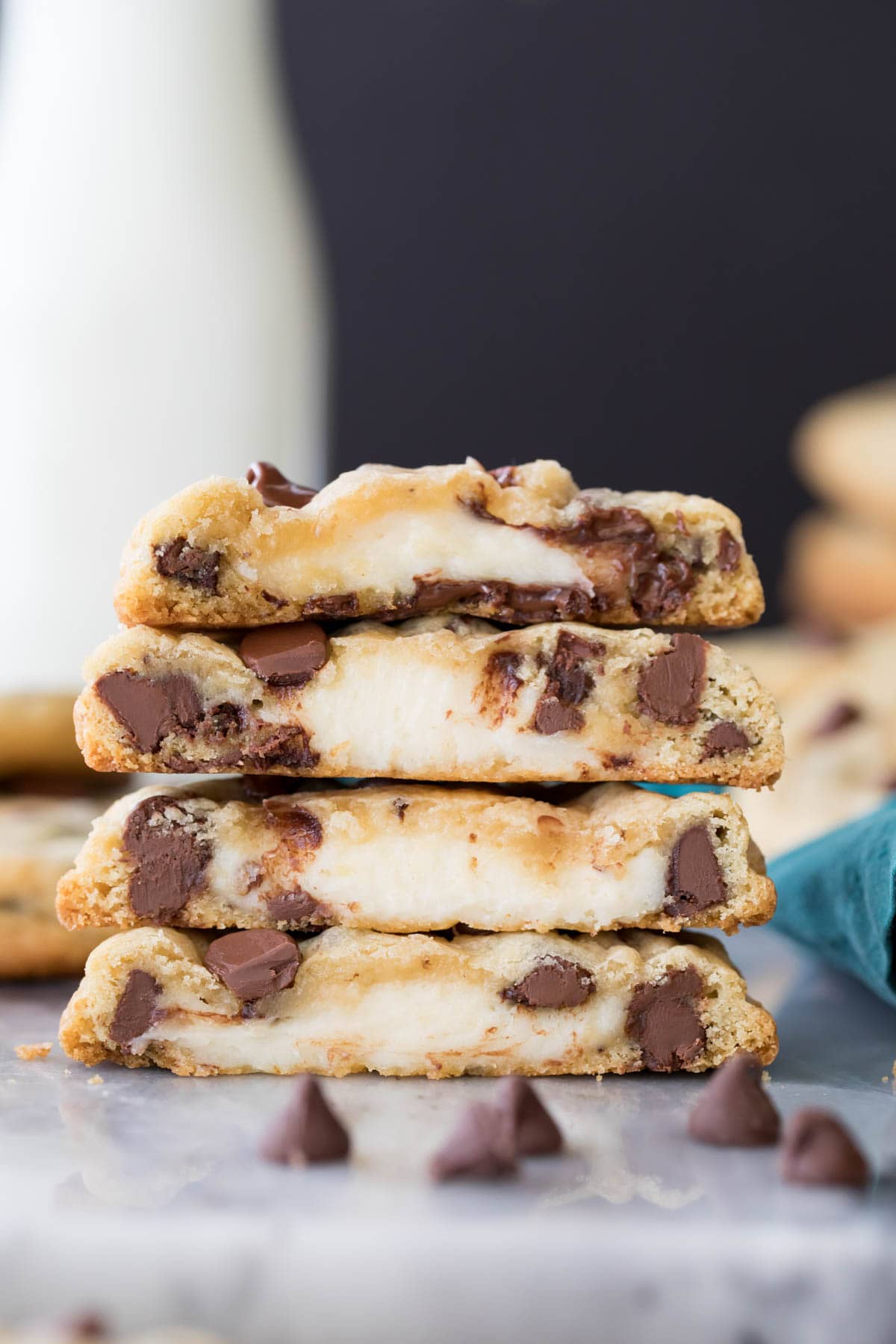 stack of cookies that have been cut in half, showing cheesecake centers