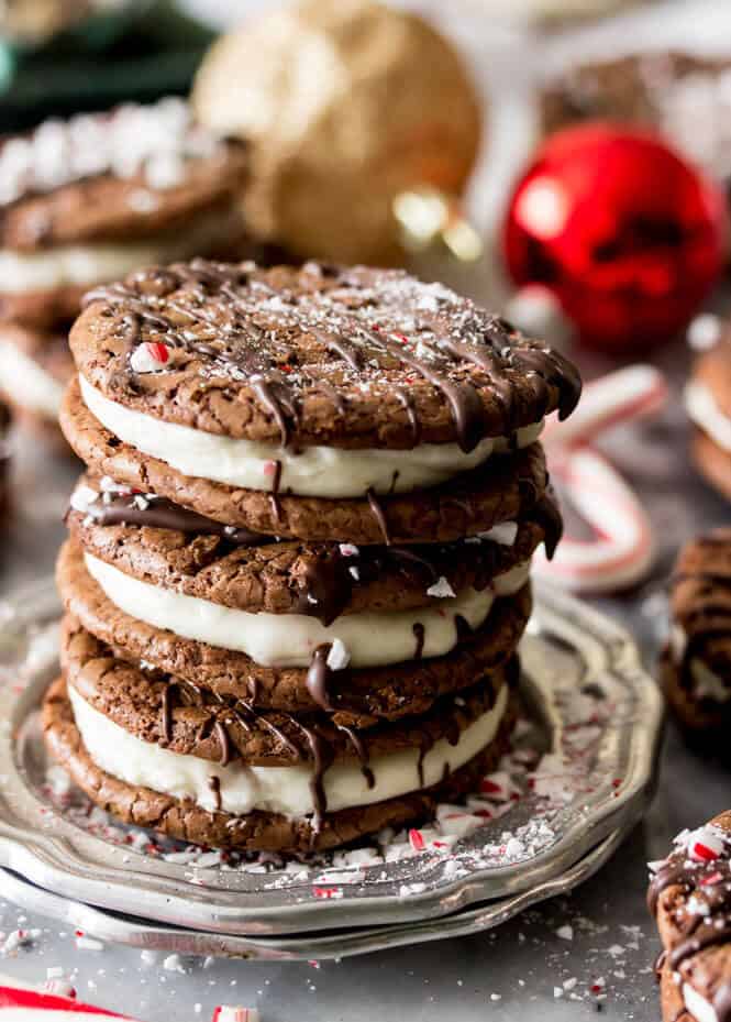 Stack of three chocolate peppermint sandwich cookies on a silver plate
