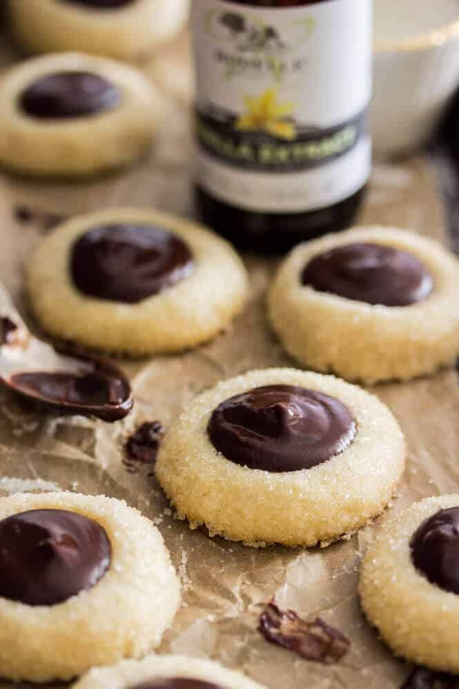 Chocolate Thumbprint Cookies -- Make sure you add a little bourbon to the ganache, it's amazing! || Sugar Spun Run