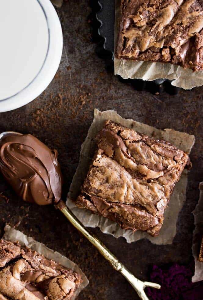 Overhead of nutella brownie squares, and a spoon of nutella