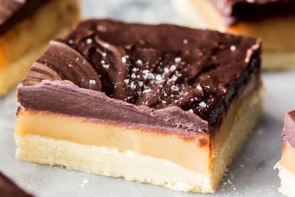 Caramel Millionaire's Shortbread bar. Layer of shortbread, caramel, and chocolate topped with sea salt.