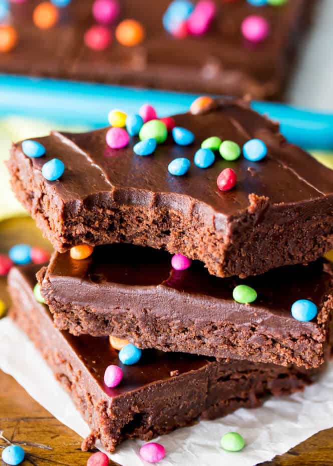 Stack of cosmic brownies with bite out of it -- showing chocolatey interior