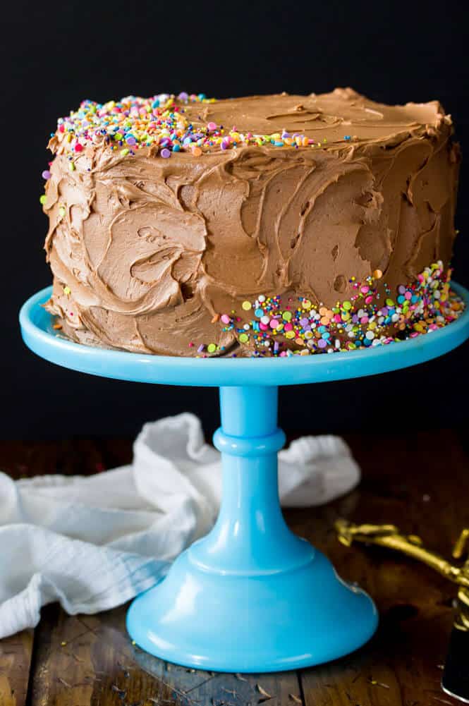 Chocolate cake on a blue cake stand