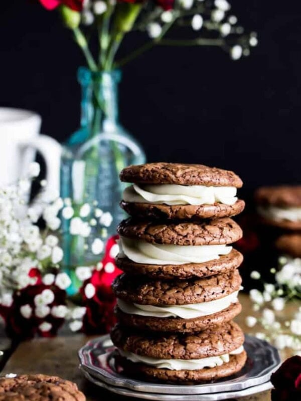Stack of four espresso and cream cookies on a plate