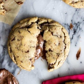 Nutella stuffed cookies, broken open to show Nutella stuffing